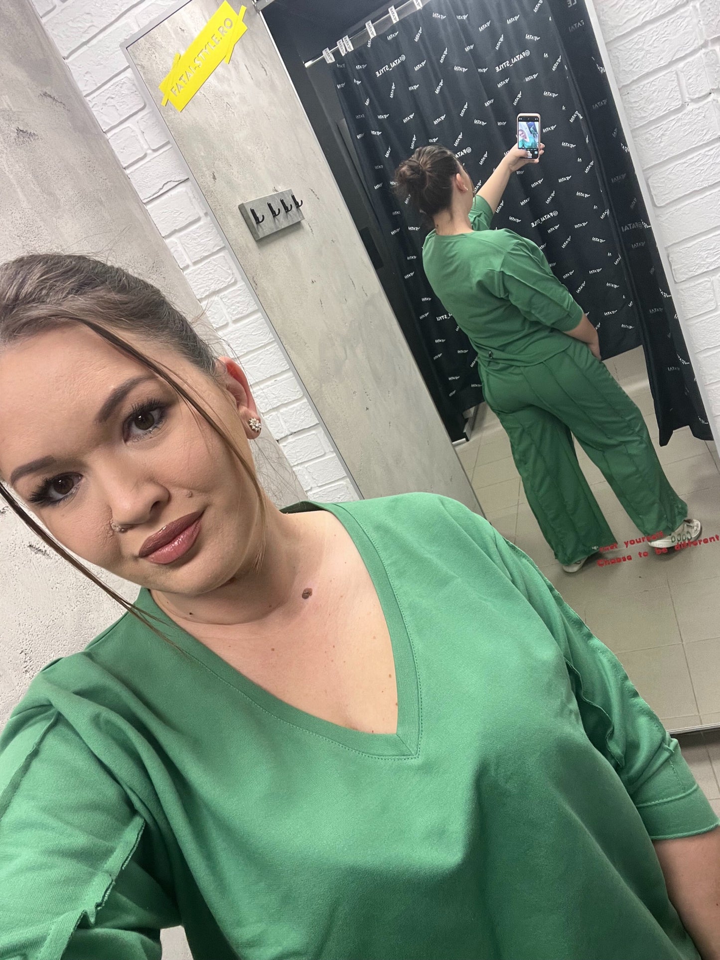 Green tracksuit with multiple cuts