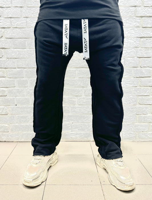 Black trousers with multiple sewings and zips, large
