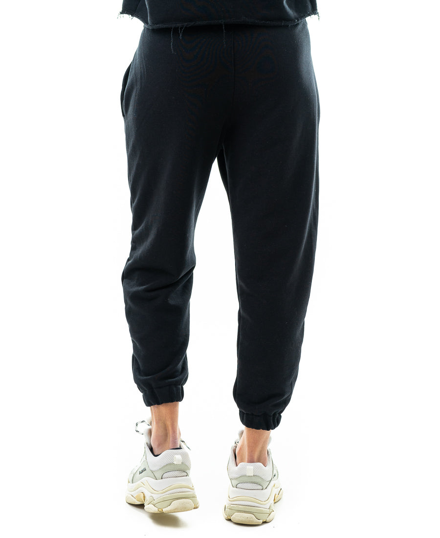 Pantaloni negri cu o taietura pe picior si elastec la glezna