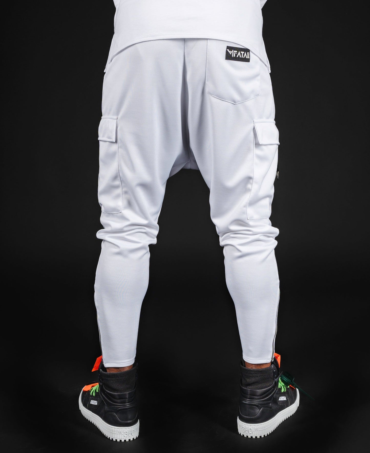 White trousers with black accesories