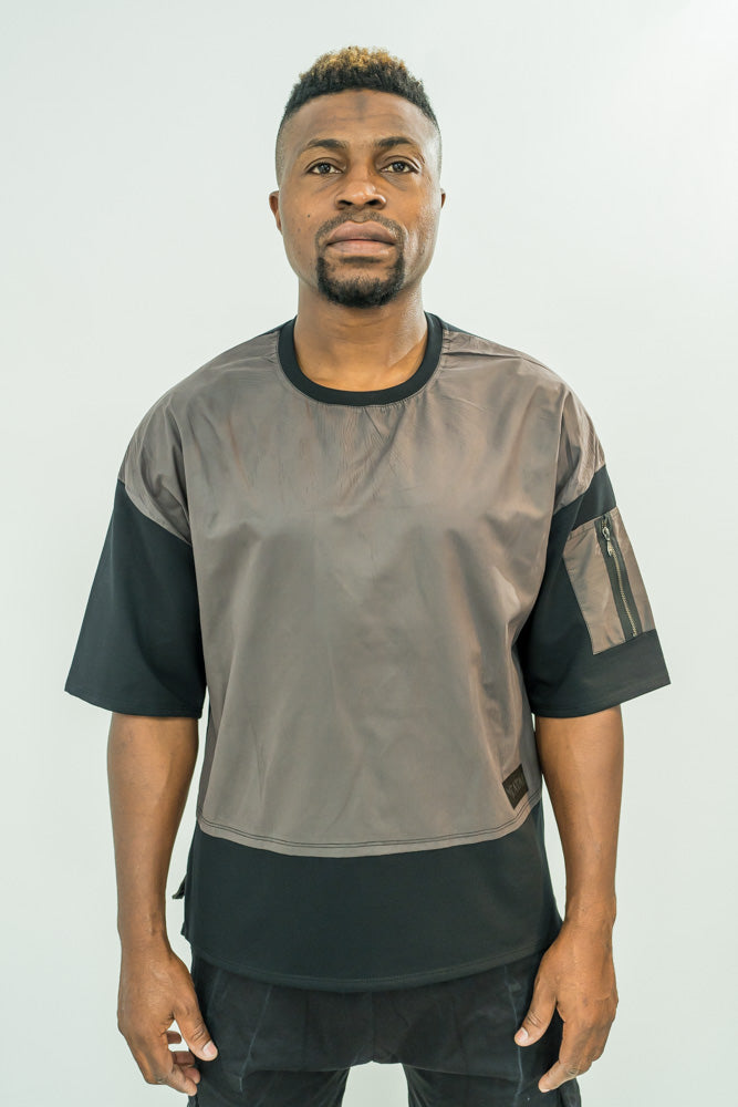 Black t-shirt combined with different material and with zip on the hand