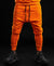 Orange trousers with printed text