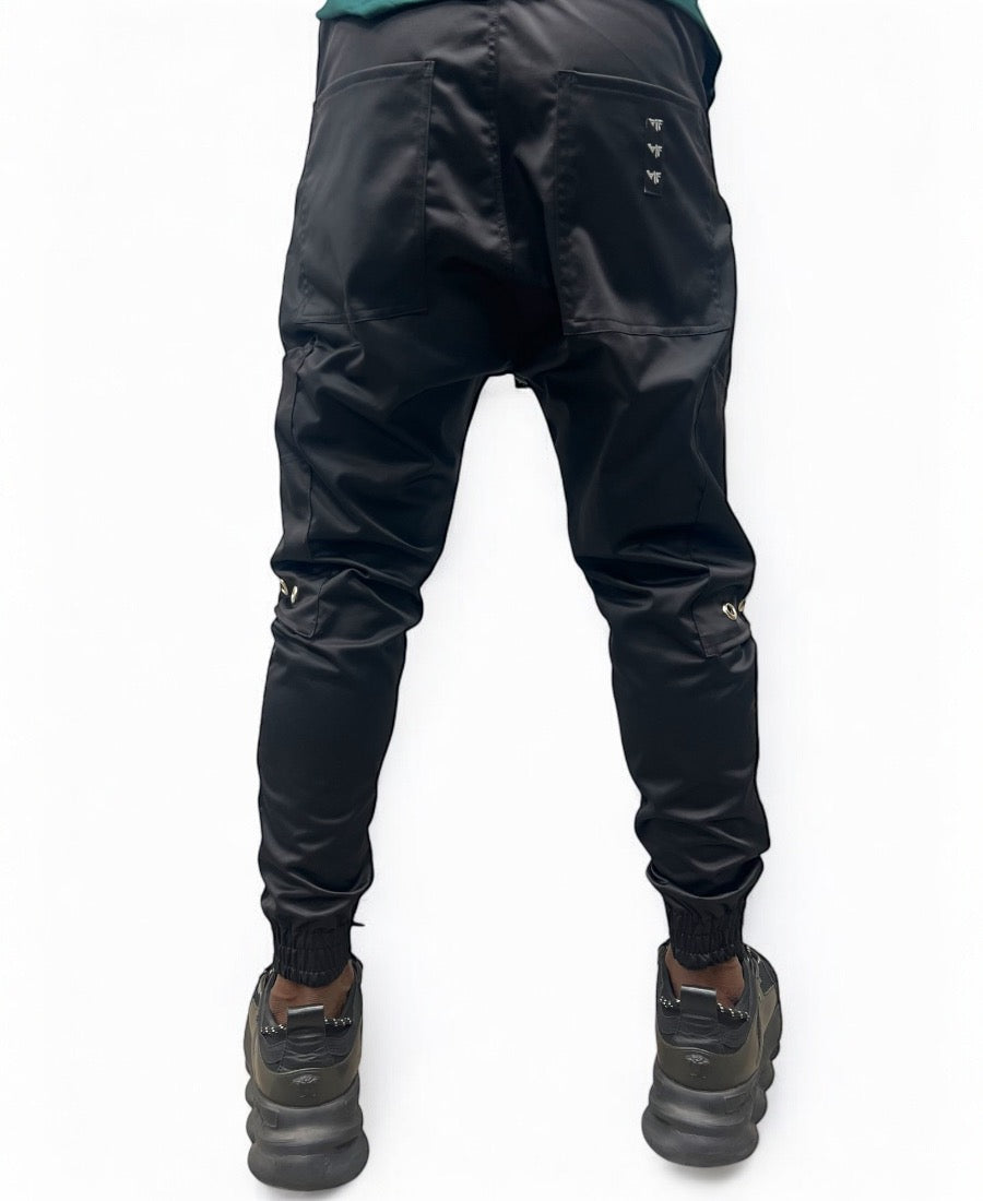 Black trousers made with shiney material and side pockets