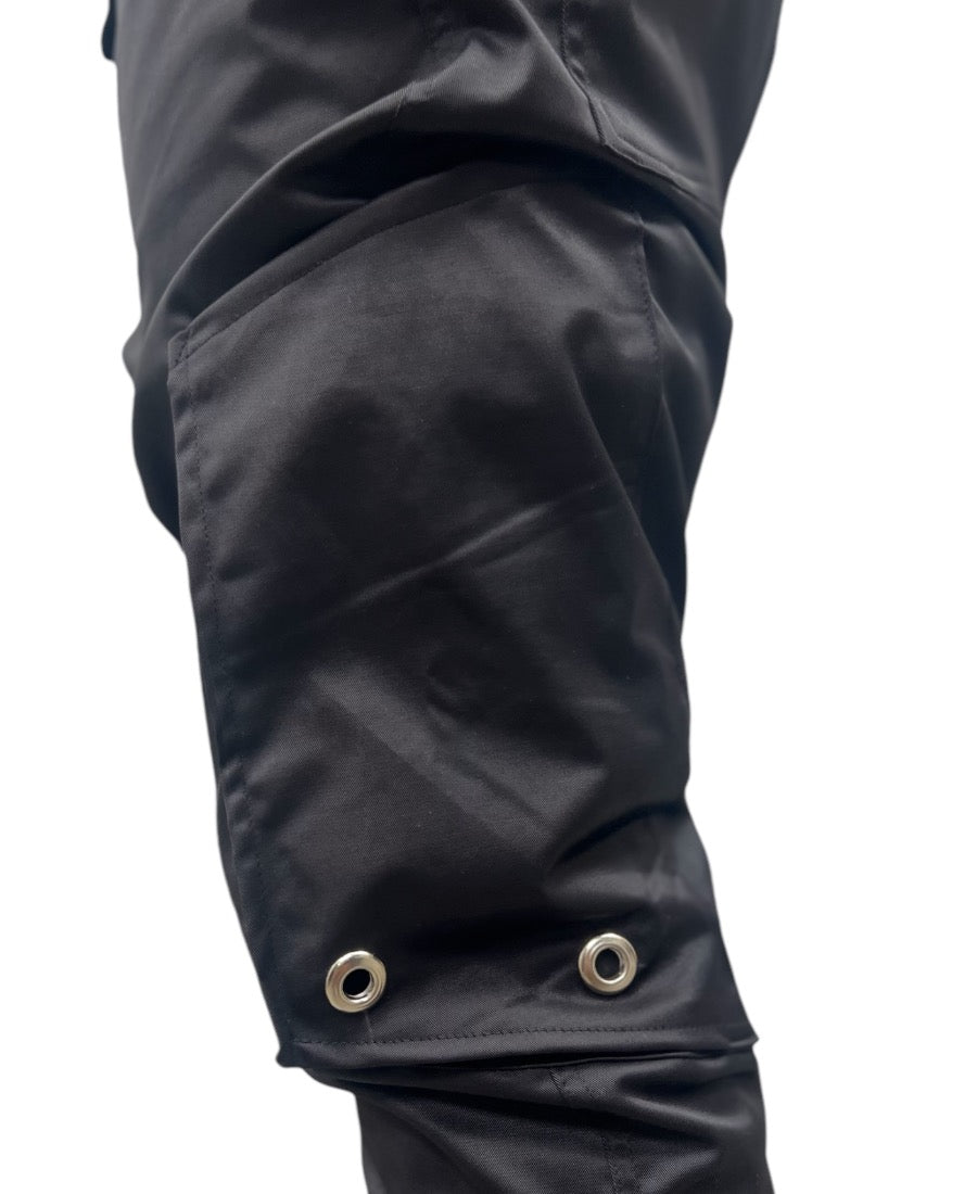 Black trousers made with shiney material and side pockets
