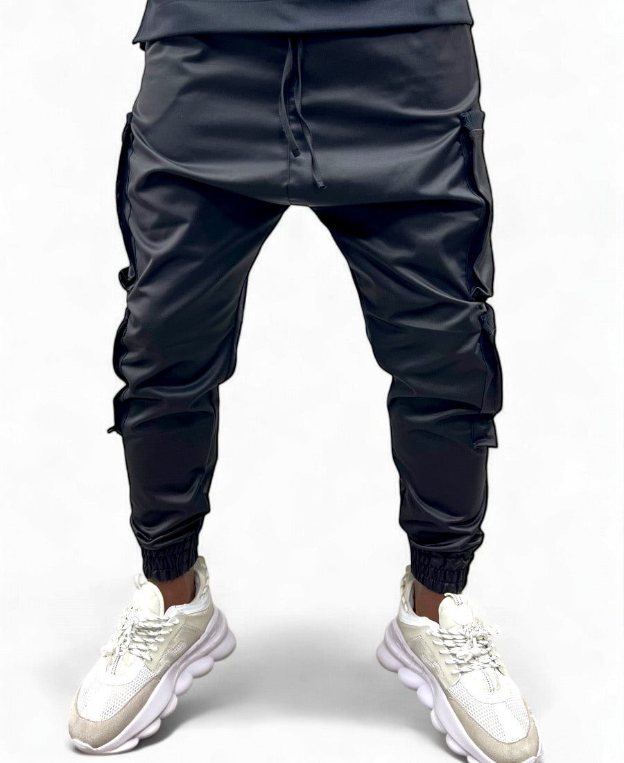 Black trousers made with shiny material and side pockets