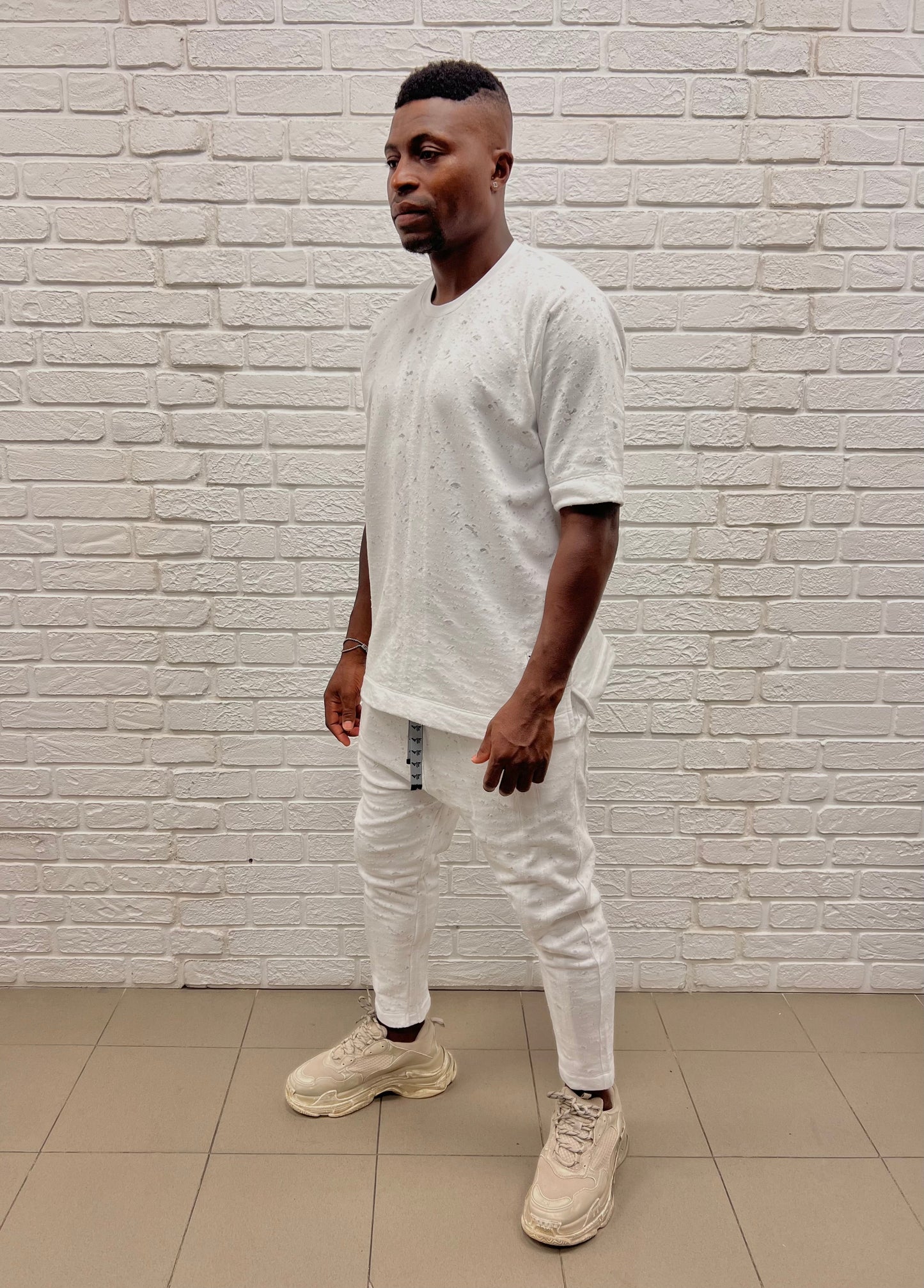 White trousers with special texture and vertical lines as design