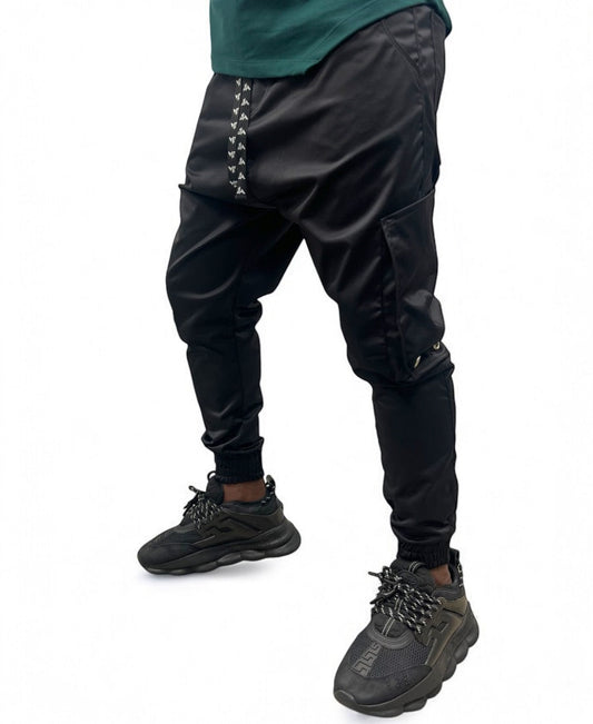 Black trousers made with shiney material and side pockets