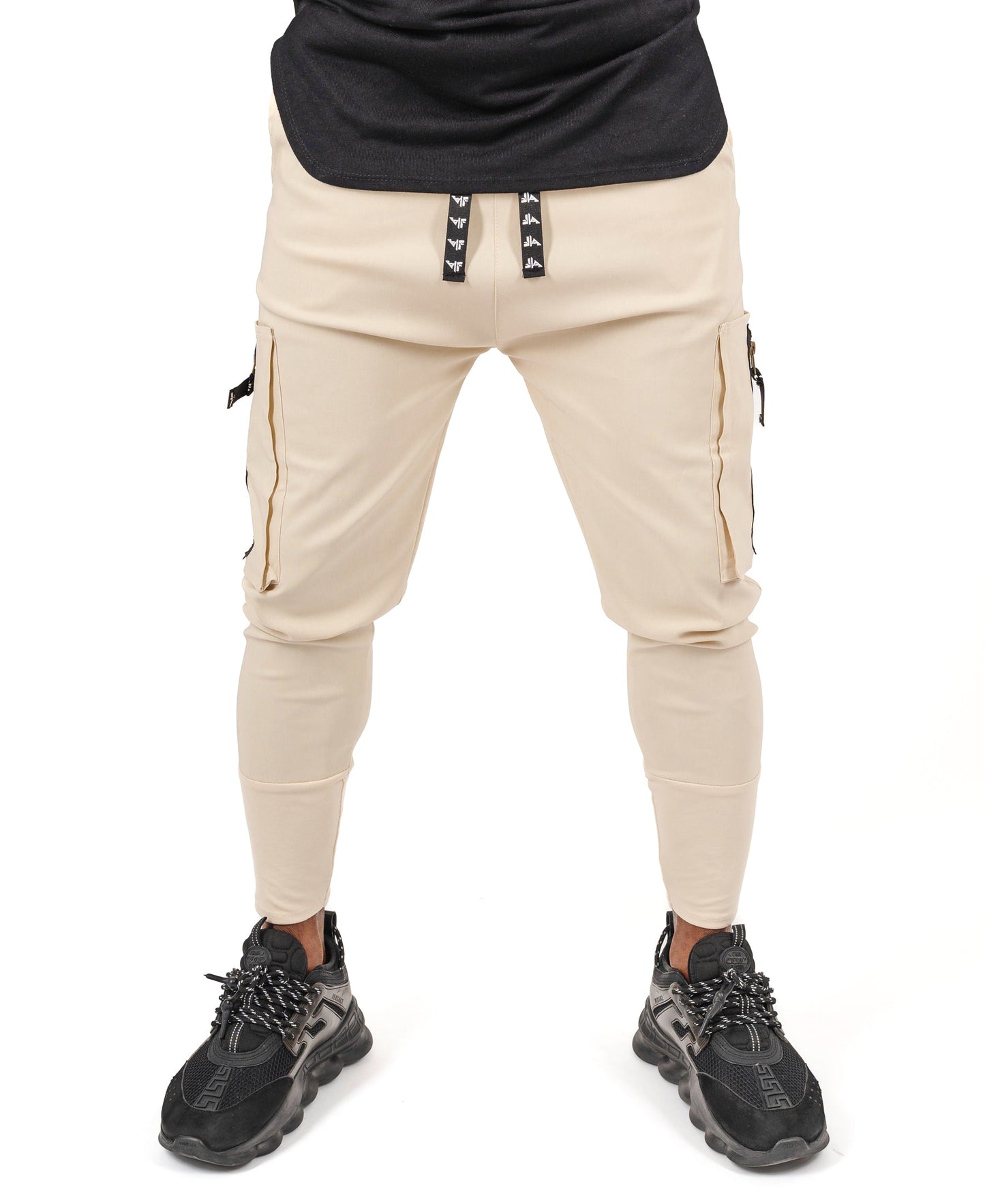 Cream trousers with side pockets and logo