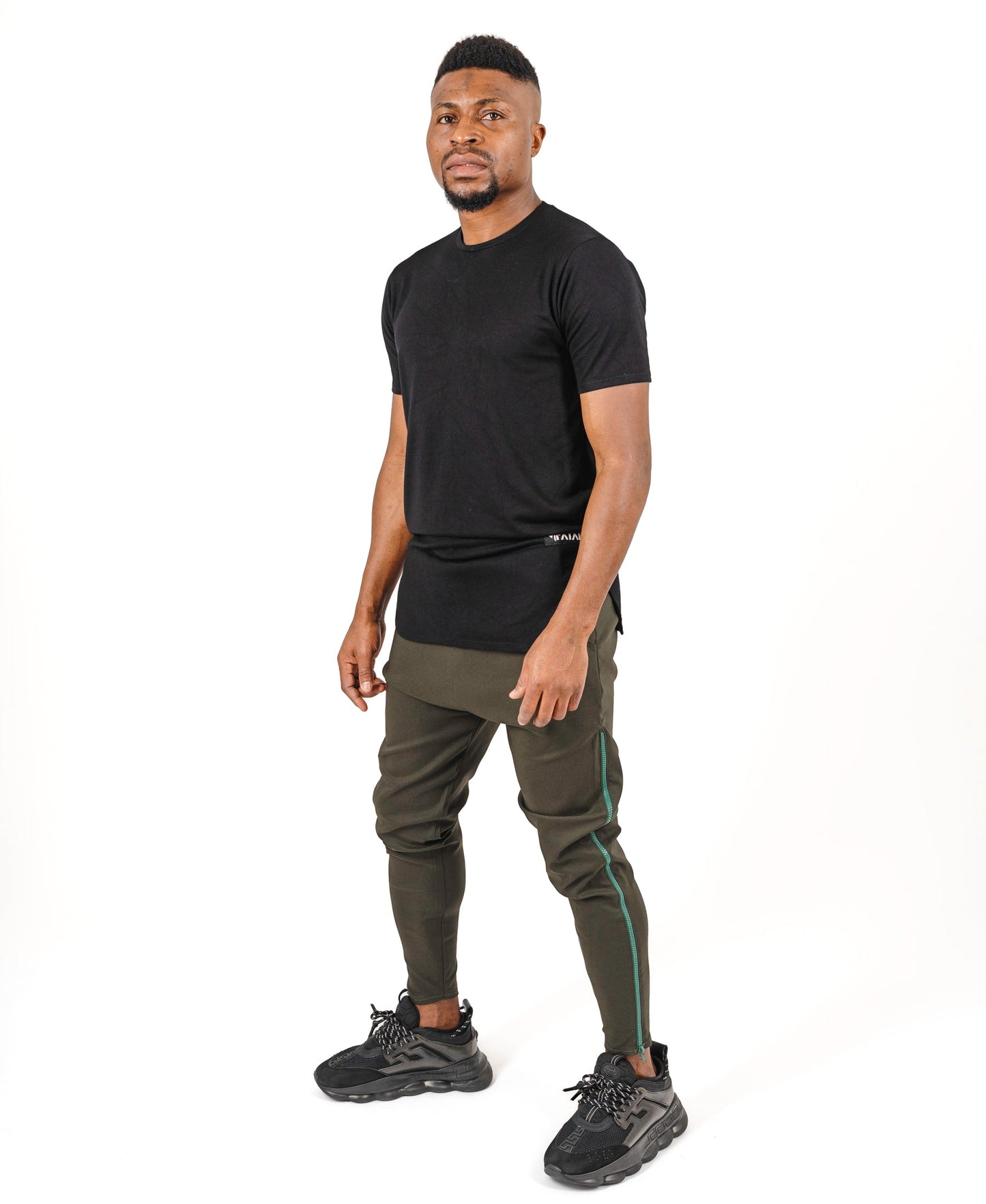 Khaki trousers with long green side zip