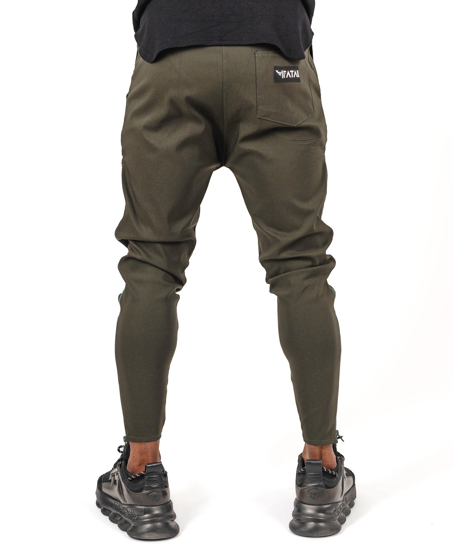 Khaki trousers with long green side zip