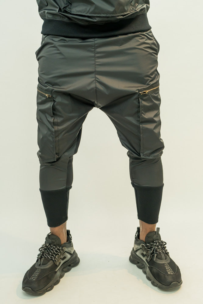 Black trousers with different combination of texture and attached zips