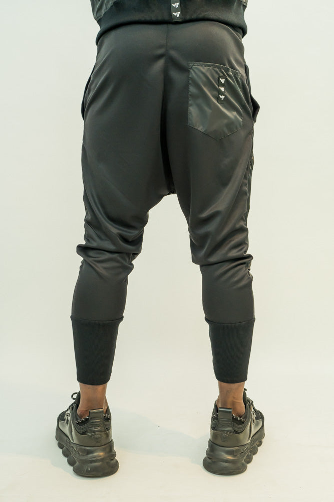 Black trousers with different combination of texture and attached zips