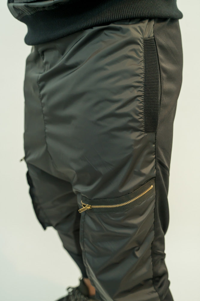 Black trousers with different combination of texture and attached zips
