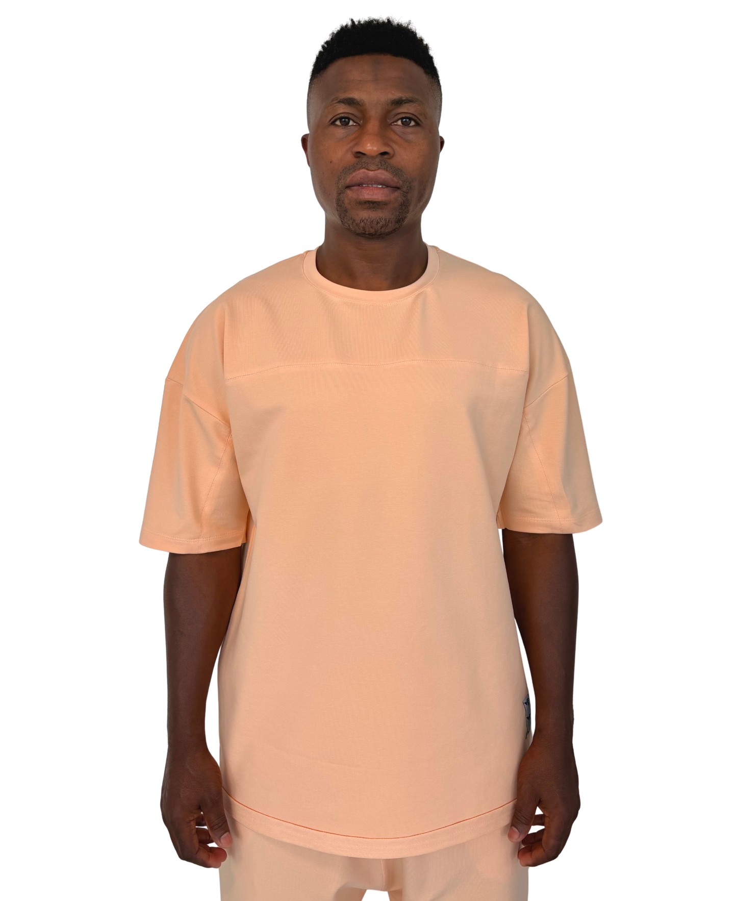 Tricou cu diverse cusaturi in nuanta somon