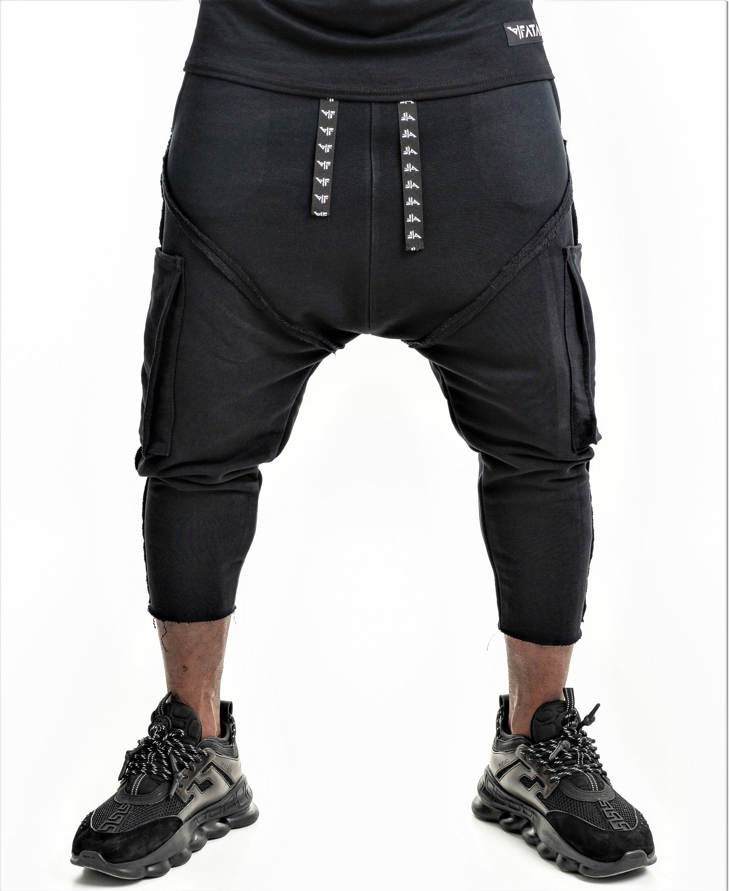 Black trousers with applied pockets and sewings