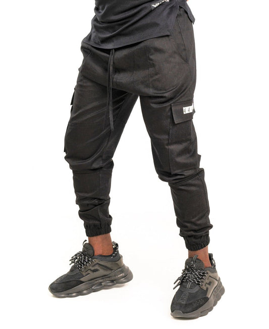 Pantaloni negri cu diverse cusaturi tip blugi