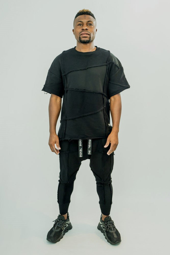 Black trousers with multiple sewings