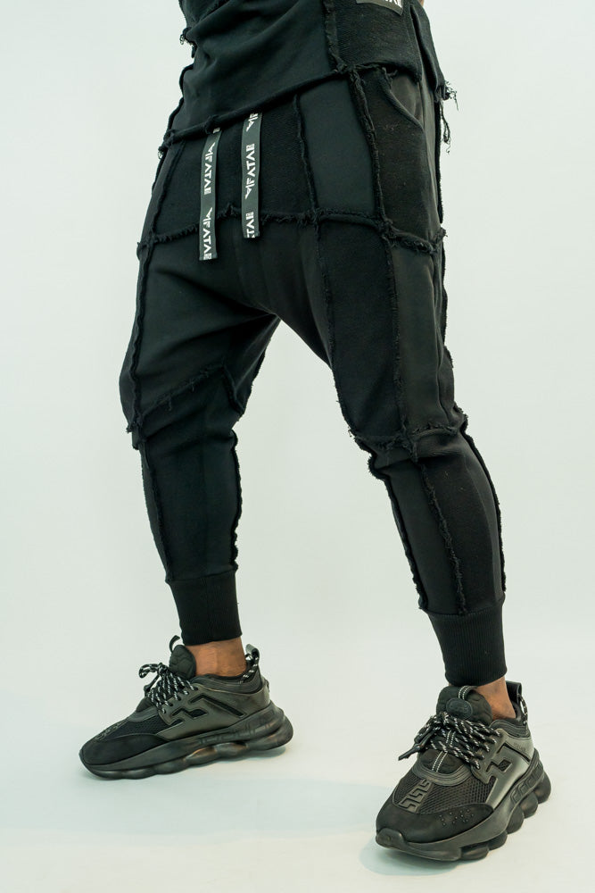 Black trousers with multiple sewings