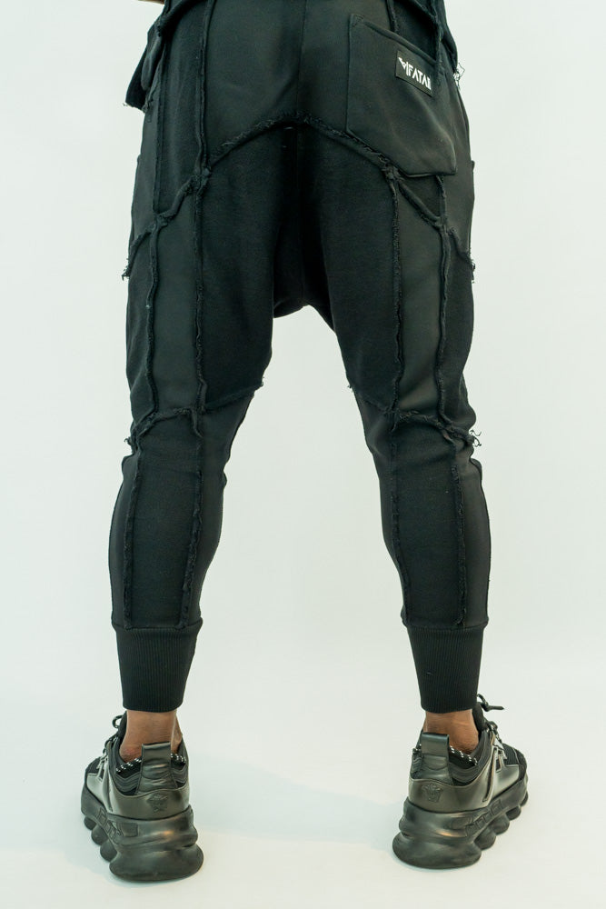 Black trousers with multiple sewings
